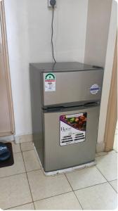 een koelkast staat op de vloer in een keuken bij Secure, modern 1 bedroom at juja in Juja