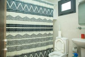 Ένα μπάνιο στο Cozy Apartment Riviera Palmeraie