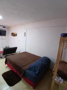 Ένα ή περισσότερα κρεβάτια σε δωμάτιο στο Departamento J&J