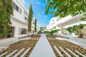 an empty street in front of a building at Mabaat-Jasmine Greek Villa 4BR- 583 Villa 5 in Jeddah