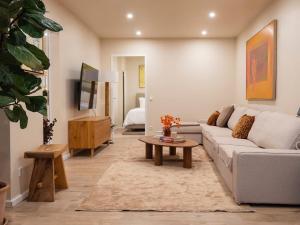 a living room with a couch and a coffee table at Luxury apartments in the city center - Berlin in Fellbach