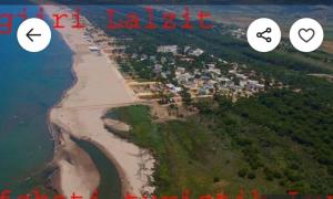an aerial view of a beach next to the water at A beautiful Beach House Gjiri Lalzit in Fushë-Draç