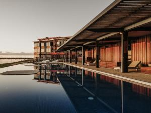a building with a pool of water in front of it at The Sebel Yarrawonga Silverwoods in Yarrawonga