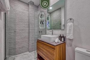 a bathroom with a sink and a shower at 2BR Condo with Private Balcony - Padel Court in Nuevo Nayarit +29 photos