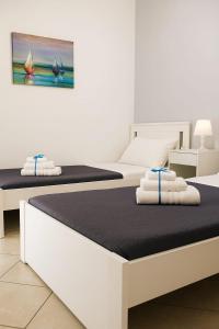 Ένα ή περισσότερα κρεβάτια σε δωμάτιο στο Archè apartment AGRIGENTO +2 φωτογραφίες