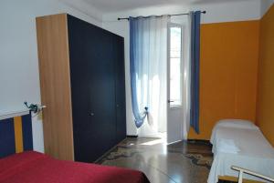Postel nebo postele na pokoji v ubytování Albergo La Vela