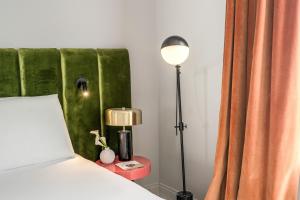 Ένα ή περισσότερα κρεβάτια σε δωμάτιο στο Hotel Della Prassede +8 φωτογραφίες