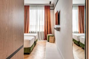 Ένα ή περισσότερα κρεβάτια σε δωμάτιο στο Hotel Della Prassede