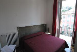 Postel nebo postele na pokoji v ubytování Albergo La Vela