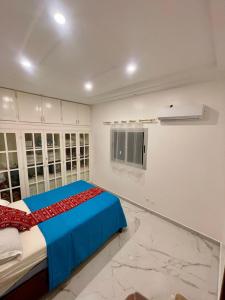 Ένα ή περισσότερα κρεβάτια σε δωμάτιο στο Appartement spacieux tout confort