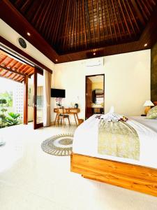 Ένα ή περισσότερα κρεβάτια σε δωμάτιο στο D'Uma Pandan the Charming Villa & Near Keramas Beach