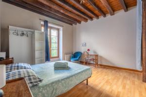 a large room with a bed and a table at L'escapade blésoise - Hyper Centre in Blois