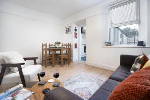 a living room with a couch and a table at Three Bridges - 1-Mile from Ulverston Town Centre in Ulverston