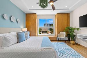 a bedroom with a large bed and a window at New Stylish 1 BR Condo - Ocean Views - Flex Room in Bucerías +42 photos