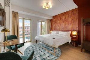Katil atau katil-katil dalam bilik di Duke Studio Hotel