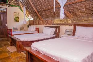 ディアニ・ビーチにあるVilla Mozillaの部屋にベッドが2つある部屋 +70枚の写真