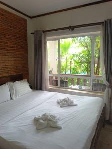 Katil atau katil-katil dalam bilik di Lika's Family Pool Villa +11 gambar