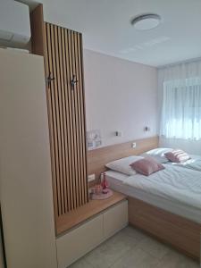Postel nebo postele na pokoji v ubytování APARTMA BriGITA