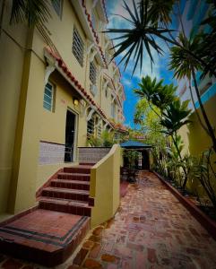a building with a brick walkway in front of it at Canario Boutique Hotel in San Juan +24 photos