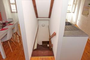 a stairway in a tiny house with a table at Holiday home Castelier in Vodnjan