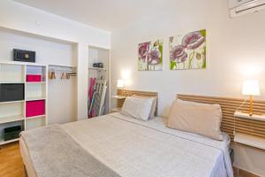 a bedroom with a bed with two pillows at SALT 6 Sur la plage de la BaieOrientale, appart 1ch in Orient Bay +6 photos