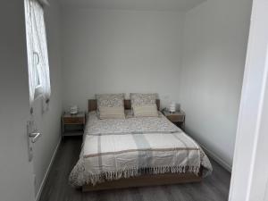 Postel nebo postele na pokoji v ubytování le relais des étangs