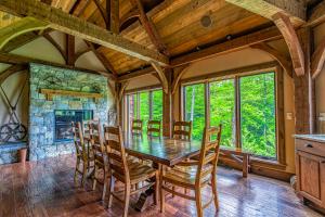 a dining room with a table and chairs and a fireplace at Mountain Estate Main House in Newry
