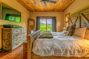 a bedroom with a bed and a wooden ceiling at Mountain Estate Main House in Newry +32 photos