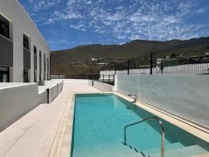 a swimming pool on the side of a building at Korner in Adeje