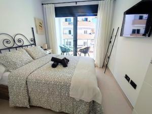 a bedroom with a bed with a black teddy bear on it at Korner in Adeje +21 photos
