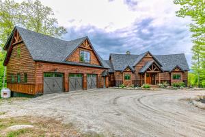 a large log home with a garage at Mountain Estate Main House in Newry