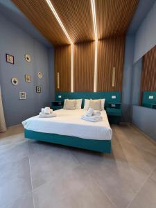 a bedroom with a large bed in a room at Conte Luxury Rooms in Salerno