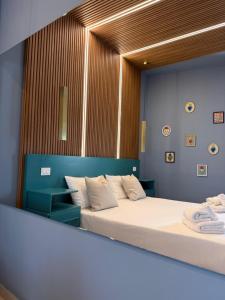 a bedroom with two beds and a mirror at Conte Luxury Rooms in Salerno