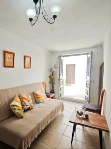 a living room with a couch and a table at Casa Rural Galaroza La Bella in Galaroza