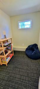 a room with a bean bag bed and a window at Welcome to Bluebird Cottage in Lakeview