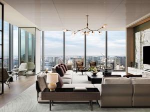 a living room with a view of a city at Fairmont Tokyo in Tokyo