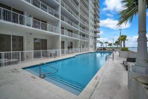 a swimming pool in front of a building at Lux condo on 25floor in Brickell in Miami