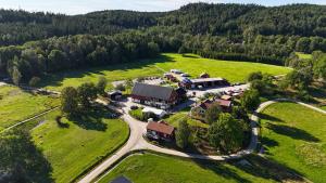 an aerial view of a large house in a field at Älgbergets Bed & Breakfast in Ucklum