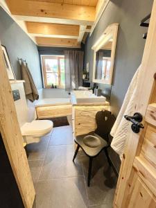 a bathroom with a sink and a toilet at Ferienwohnung Dahoam in Bernau am Chiemsee