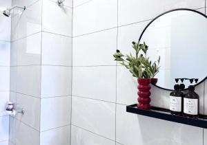 a bathroom with a red vase with wine bottles at Amber Cove l Luxury Suites 2BR l 6-9pax l GamesRoom l City Centre l Jonker St l Encore l Playground by Jay Stay in Melaka +35 photos