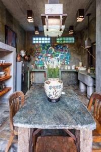 a kitchen with a table with a vase on it at House Cottage in Caribbean Mountains 2 