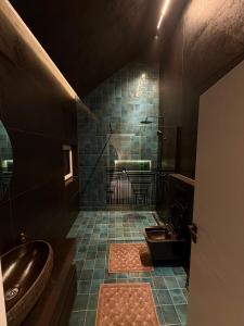 a bathroom with a tub and a sink and a shower at Brezovica Lux in Brezovicë