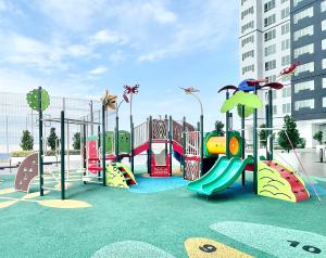 a childrens playground with a slide and a play equipment at Amber Cove l Luxury Suites 2BR l 6-9pax l GamesRoom l City Centre l Jonker St l Encore l Playground by Jay Stay in Melaka