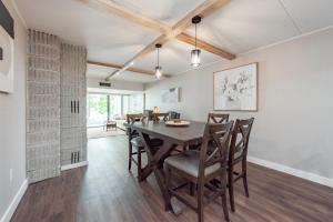 a dining room with a wooden table and chairs at 107B One Bedroom One Bath in Thayerville