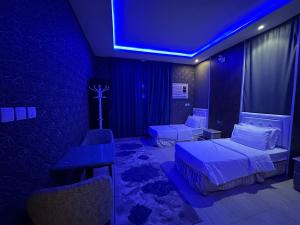 Ένα ή περισσότερα κρεβάτια σε δωμάτιο στο شقق في بلجرشي