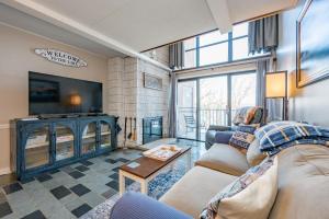 a living room with two couches and a tv at 508G Two Bedroom One Bath in Thayerville