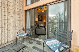 a patio with two chairs and a bench on a balcony at 508G Two Bedroom One Bath in Thayerville