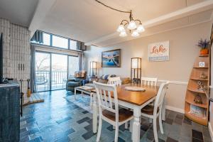 a dining room and living room with a table and chairs at 508G Two Bedroom One Bath in Thayerville