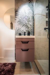 a bathroom with a sink and a shower at Casa Familiei Dambovicioara in Podu Dîmboviţei