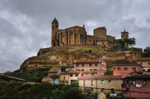 a castle on top of a hill with houses at Casona de Barrabás in San Vicente de la Sonsierra
